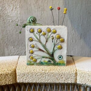 Ceramic Flower Brick by Angela Evans.